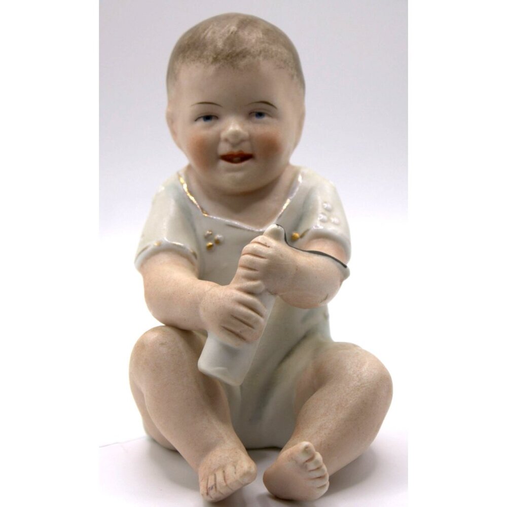 Vintage Porcelain Piano Baby With Tooth Figurine Holding Bottle 4" Tall
